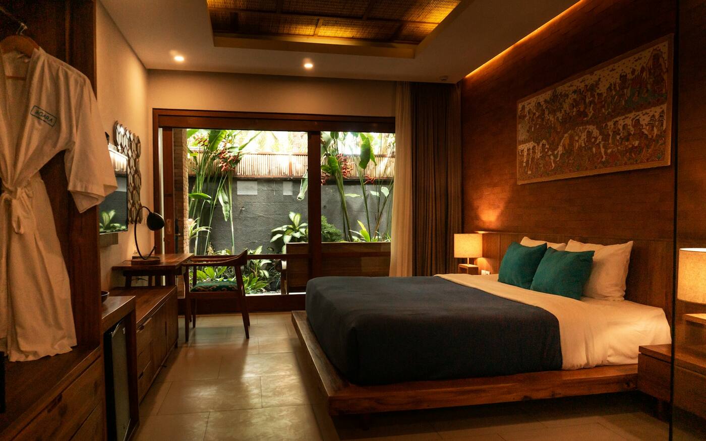 A garden room with a double bed and green views